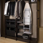 Cabinet closet with pull out ironing board